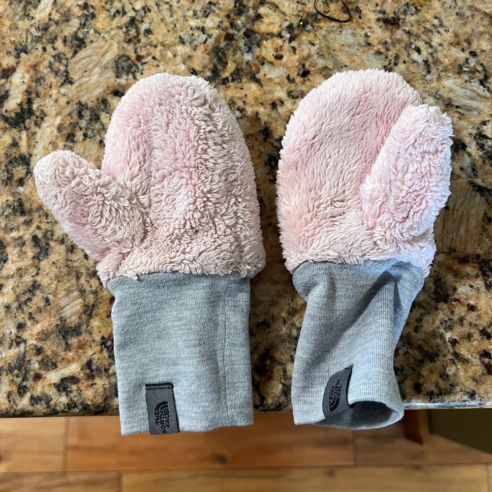 The North Face light pink fleece mittens.